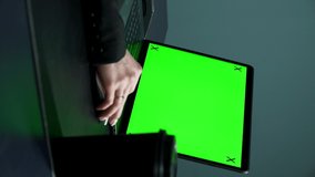 vertical video. female hand on a computer mouse. green screen. 