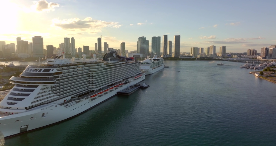 Miami, FL, USA - December 4, 2021: Cruise ships and terminals at Port Miami. 5k aerial b roll at sunset