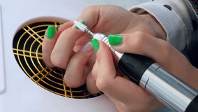 Female hands making manicure. Hardware Removes gel polish from the nail. Nail care, Self care. Do manicure by yourself while stay at home. Diy. Removing the material