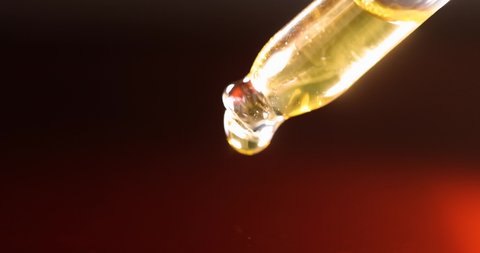 Clear Yellow Liquid Dripping Pipette Slow Stock Footage Video (100%