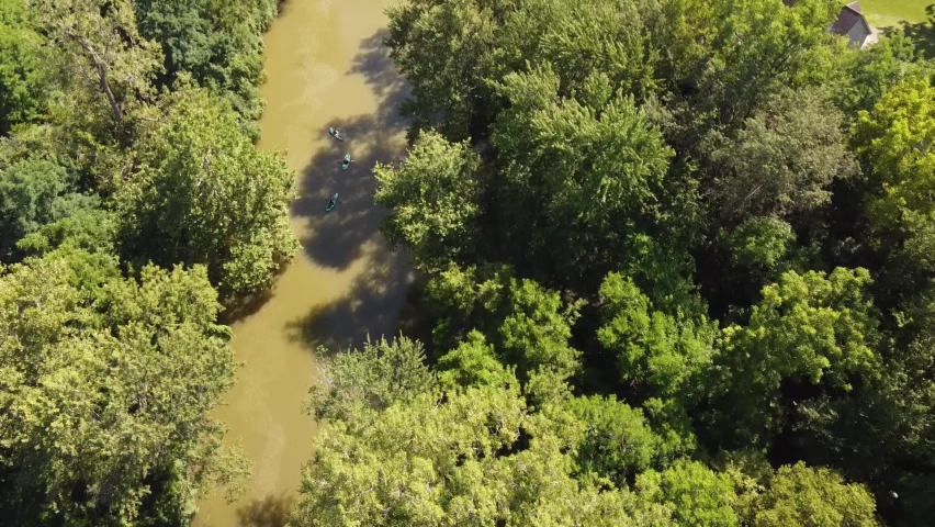 Kayakers going down Huron River near Flat Rock in Southeast Michigan at Daytime - aerial top down