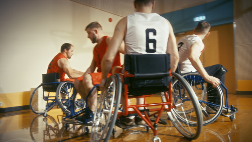 Wheelchair Basketball Game Court: Paraplegic Professional Players Competing, Passing, Shooting Ball. Determination, Inspiration, and Skill of a People with Disability. Slow Motion | Shutterstock HD Video #1083576688
