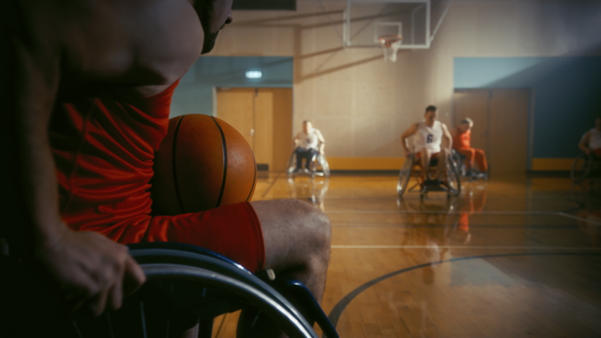 Wheelchair Basketball Game Court: Players Competing, Dribbling, Shooting it Successfully, Score Goal Points. Determination, Skill of People with Disability. Slow Motion, Handheld Following Shot Royalty-Free Stock Footage #1083576694