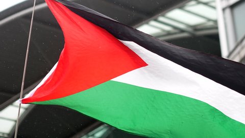 Norwich, Norfolk, United Kingdom. May 22, 2021. Palestinian flag wahing.Free Palestine Protest, Norwich. Demonstrators gather and march with banners, flags, placards and shouting.