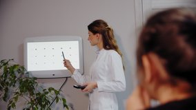 The ophthalmologist examines the young patient's eye. Wide shot - Powered by Shutterstock - Get 15% off with code: PIKWIZARD15