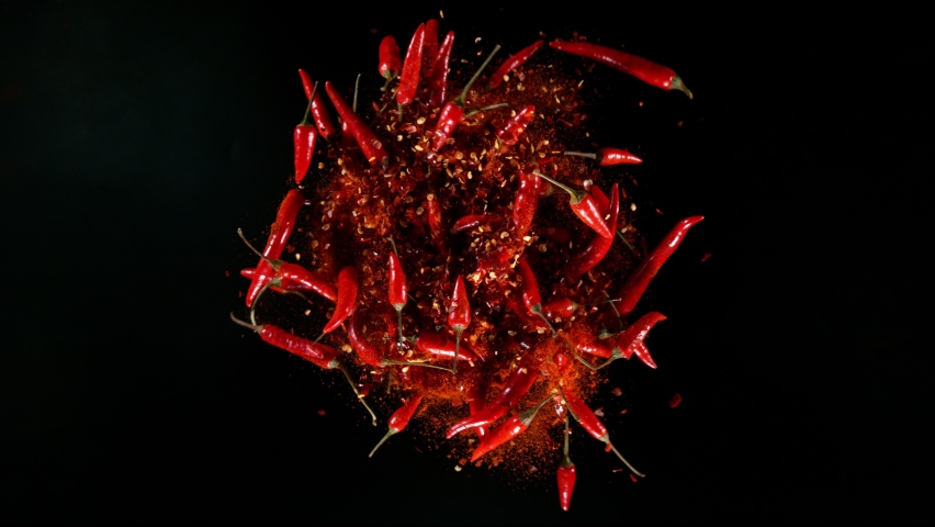 Super Slow Motion Shot of Rotating Red Chilli Peppers with Powder, Filmed on High Speed Cinematic Camera at 1000 fps. Royalty-Free Stock Footage #1083588241