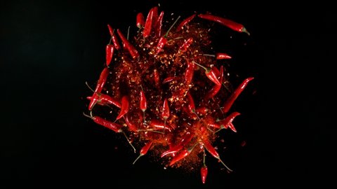 Super Slow Motion Shot of Rotating Red Chilli Peppers with Powder, Filmed on High Speed Cinematic Camera at 1000 fps.