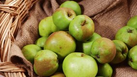 Apples for baking in vintage woven basket medium shot selective focus - Powered by Shutterstock - Get 15% off with code: PIKWIZARD15