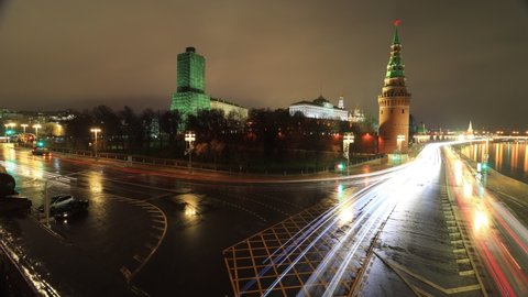 timelapse with tracers of traffic at night on the Kremlin embankment near the Borovitskaya square in Moscow, Russia