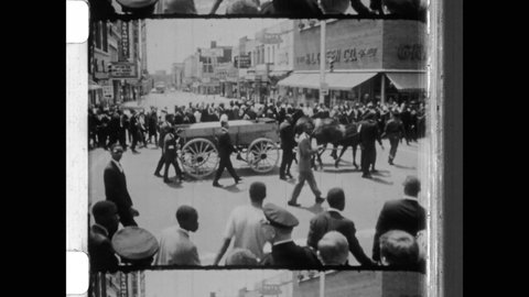 April 9, 1968, Atlanta, GA, Martin Luther King Jr.'s casket being pulled by horse-drawn carriage in the funeral procession after being killed by assassin's bullet in Memphis.  4K Overscan of Newsreel