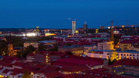 Gothenburg, Sweden. Aerial view of the city center of Gothenburg, Sweden during the sunset from evening to night. Historical buildings with blue sky. Time-lapse with car traffic, zoom in