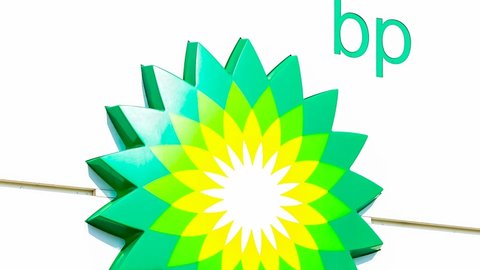Moscow, Russia - December 7, 2021: BP - British Petroleum petrol station logo over blue sky. British Petroleum is a British multinational oil and gas company