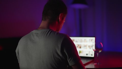 Man secretly watching porn sites at night.