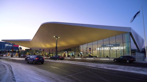 VANTAA, FINLAND - DEC 5, 2021: New modern renovated terminal at Helsinki Vantaa Airport, with architecture by classical Finnish design style at night.