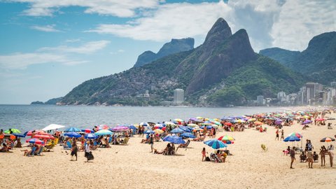 Time lapse view of people enjoying the summer at famous Ipanema beach in Rio de Janeiro, Brazil. 