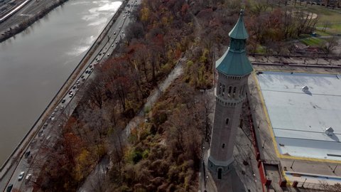 descending aerial shot of Highbridge Water Tower tilting up revealing NYC