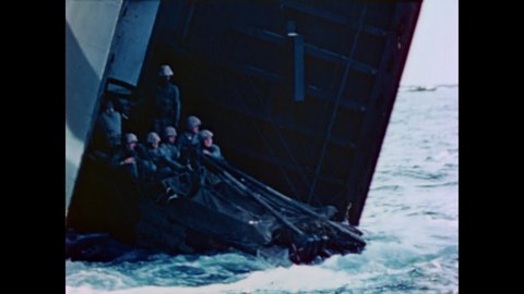CIRCA 1945 - US Marines ride landing crafts in choppy waters towards Iwo Jima.