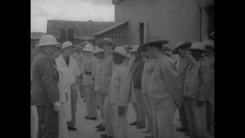 CIRCA 1939 - Governor Chot-Plassot meets with prisoners exiled to Devil's Island, and inspects their living quarters and food.