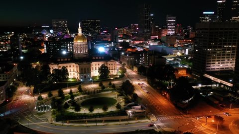ATLANTA, GEORGIA - CIRCA 2020s - Night aerial of the Atlanta State Capitol building in Atlanta, Georgia.