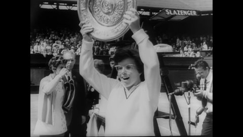 CIRCA 1966 - Billie Jean King defeats Maria Bueno at Wimbledon, and receives her trophy from Princess Marina.