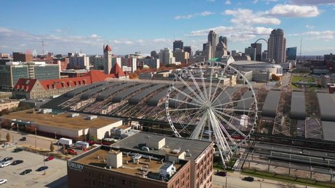 ST. LOUIS MISSOURI - CIRCA 2020s - Nice aerial over downtown St. Louis Missouri with ferris wheel foreground.