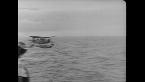 CIRCA 1942 - Seaplanes are catapulted from US Navy aircraft carriers, and return safely.