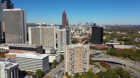 ATLANTA, GEORGIA - CIRCA 2020s - Good aerial over apartment complex and high rises in downtown Atlanta, Georgia business district.