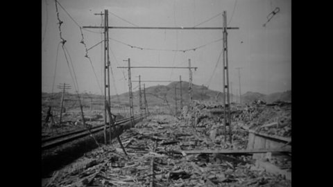 CIRCA 1945 - Steel poles meant to hold up trolley wires in Nagasaki are bent in the direction of the atomic bomb blast.