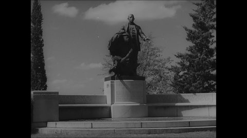 CIRCA 1939 - Lifting the Veil, the monument to Booker T. Washington, stands on the campus of Tuskegee University.