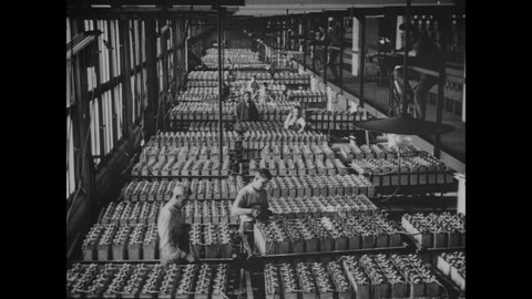 CIRCA 1926 - Men work at the Edison Storage Battery Company in Orange, New Jersey.