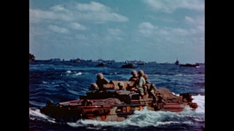 CIRCA 1945 - US Marines approach Iwo Jima in landing crafts, on choppy waters.