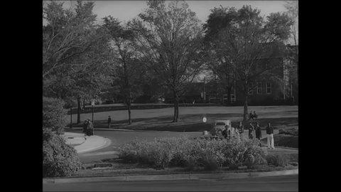 CIRCA 1939 - Students flirt at Tuskegee University.