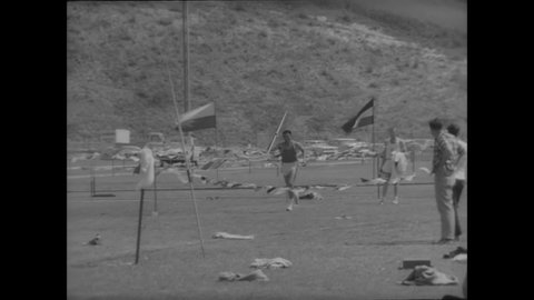 CIRCA 1963 - UCLA's CK Yang wins a decathlon, participating in the javelin throw, pole vault, and 1500 meter dash.