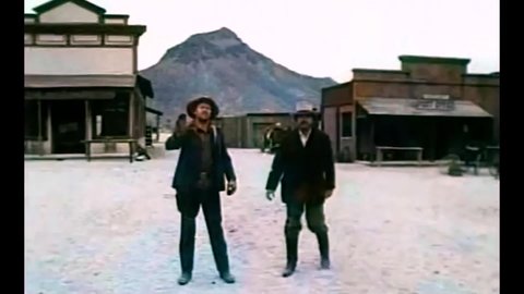 CIRCA 1974 - In this western film, a preacher surprises the town by shooting at low level thugs who stand in his way.