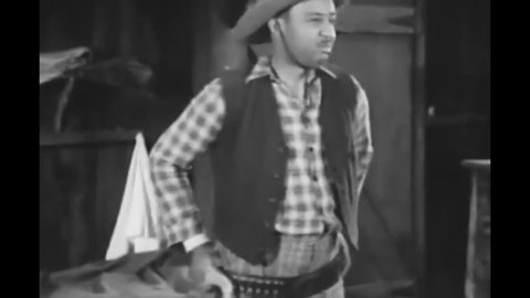 CIRCA 1939 - In this western film, African-American cowboys sing as they get ready for bed.