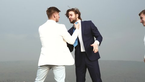 Business people fighting outdoor. Angry businessmen punching in fight and arguing having struggle for leadership on businessmeeting because, business knockout.