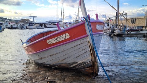 Saint-Tropez, France - December 8, 2021: 8K Old Brightly Colored Wooden Fishing Boat In The Port Of Saint-Tropez On The French Riviera, France, Europe - 8K UHD (7680 x 4320)