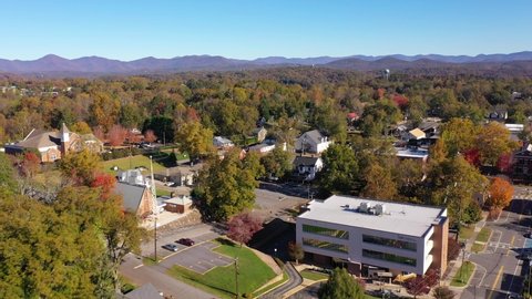 DAHLONEGA, GEORGIA - CIRCA 2020s - Nice aerial establishing shot of Blue Ridge Mountain Appalachian town of Dahlonega, Georgia.