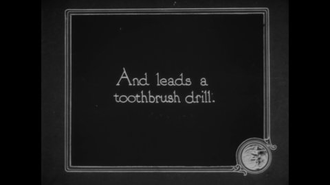 CIRCA 1919 - A school nurse teaches children how to brush their teeth.