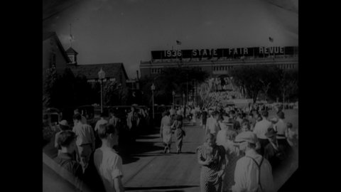 CIRCA 1936 - Visitors enjoy many exhibits and activities at the Minnesota State Fair.