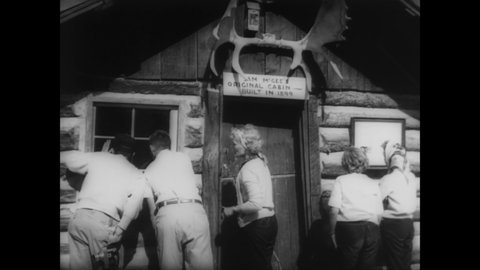 CIRCA 1962 - Tourists visit the historic gold rush city of Whitehorse, Yukon.
