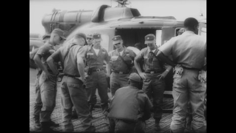 CIRCA 1964 - US military advisors help ARVN soldiers invade North Vietnam.