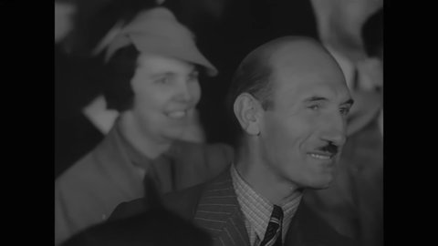 CIRCA 1937 - People cheer, sing and clap at a campaign stop for Fiorello La Guardia.