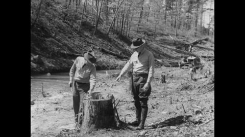 CIRCA 1937 - Men of the Civilian Conservation Corps build roads in Alabama's Shiawassee State Park.