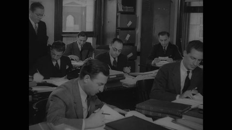 CIRCA 1937 - Accountants in Thomas Dewey's office go over the finances of organized crime bosses.