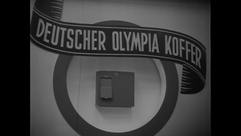 CIRCA 1940s - Nazi propaganda minister Joseph Goebbels visits an exhibit of technology used during the Berlin Olympics.