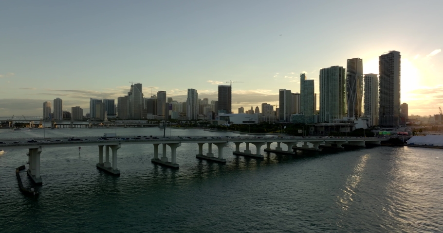 Aerial video reel traffic on the Macarthur Causeway Miami with sunset over city Royalty-Free Stock Footage #1083642175
