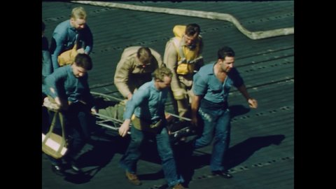 CIRCA 1944 - US Navy sailors carry a wounded man to a hospital ship, and US Navy fliers head out on their next mission.