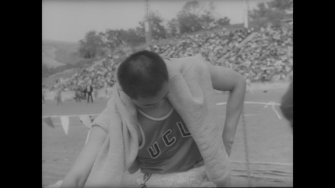CIRCA 1963 - Track and field star CK Yang racks up points for UCLA in high jump, broad jump, discus, high hurdle and shot-put events.