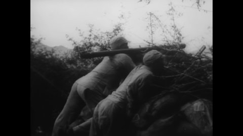 CIRCA 1944 - Chinese artillerymen fire on a Japanese garrison in Tengchong.